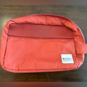 Lululemon muted red cosmetics bag